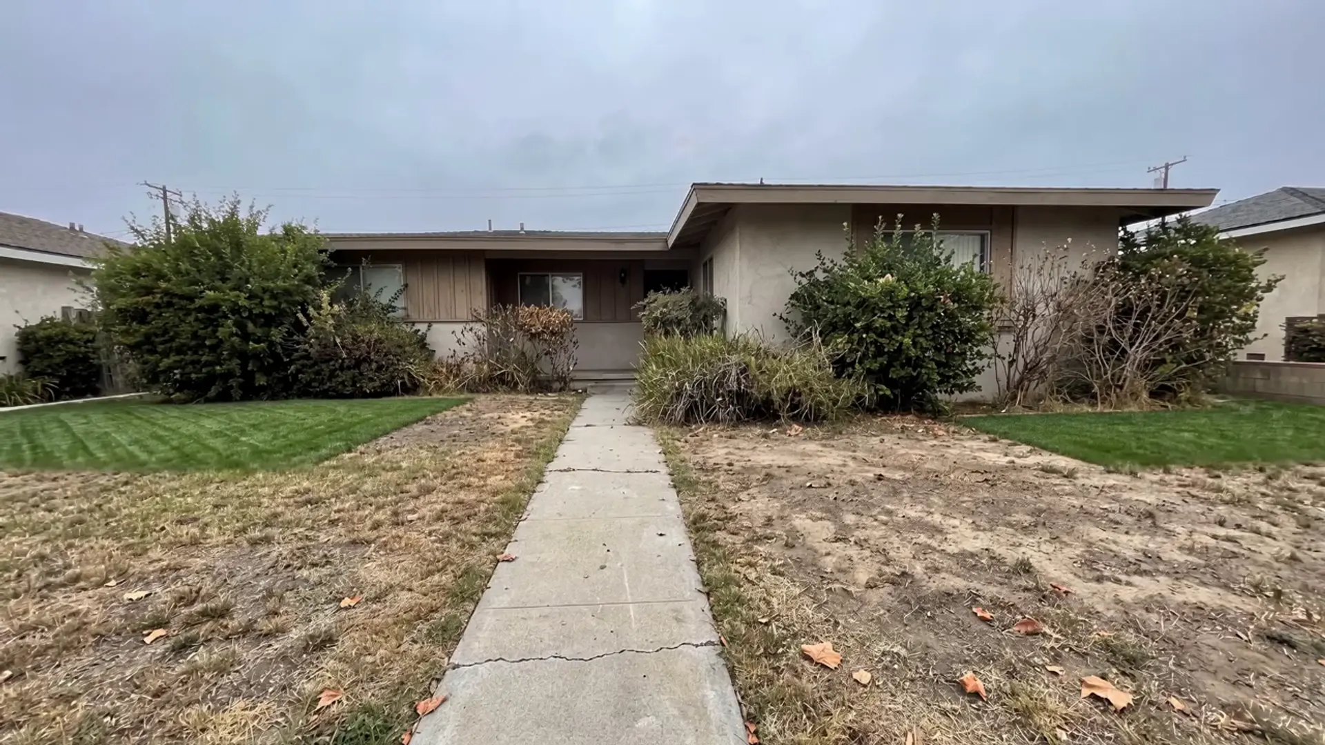 A tired Los Angeles front yard mid transformation into a lush landscaped garden by Silver Leaf Landscape